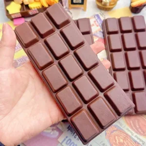 Realistic brown chocolate bar squishy toy with slow rebound for stress relief and fun