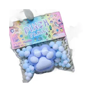 Blue flocked cat paw squishy stress relief toy with cute pixel art style packaging