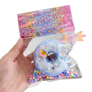 Μπλε ντόνατ παιχνίδι squishy με πολύχρωμες πέρλες αφρού σε συσκευασία έκπληξη