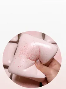 Detail view of a pink strawberry toast squishy toy showing its soft slow rebound texture