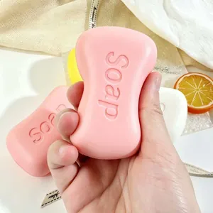Realistisches rosa Seifen-Squishy-Spielzeug zum Stressabbau, in der Hand gehalten