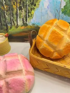 Detailed macro view of pink and yellow pineapple bun slow rebound squishy toys for stress