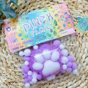 Soft purple flocked cat paw squishy toy for stress relief in decorative Pinch Family pack