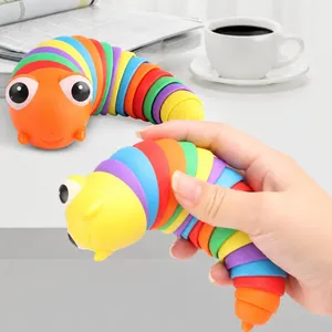 Colorful rainbow articulated slug fidget toy held in hand to show flexible movement