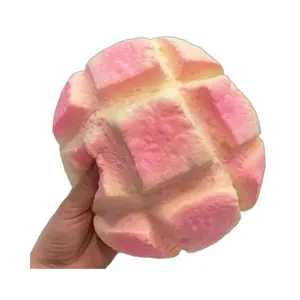 Large pink pineapple bun squishy toy with realistic bread texture for stress relief