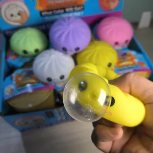 Lot de jouets squishy en forme de brioche avec baozi jaune pressé pour déstresser.