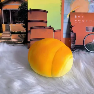 Close-up of a large yellow piggy bun squishy toy featuring soft slow rebound foam
