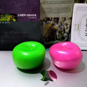 Close-up detail of bright green and pink slushy apple squishy fidget stress toys