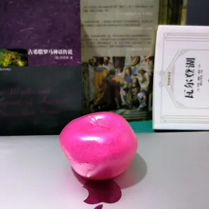 Pink translucent apple-shaped slushy squishy fidget toy shown in close-up detail.