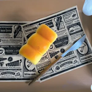 Realistic PU slow-rebound fake bread squishy toy on vintage newspaper mat with knife
