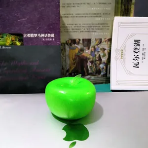 Close-up of a vibrant green apple-shaped squishy toy, perfect as a stress-relief fidget.