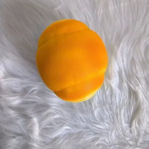 Detailed view of jumbo slow rebound squishy bread toy in orange piglet bun shape