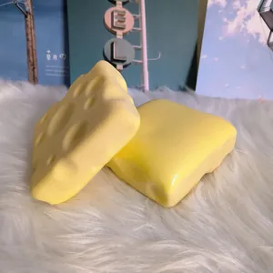 Macro view of soft texture on yellow cheese and toast shaped slow rising squishy toys