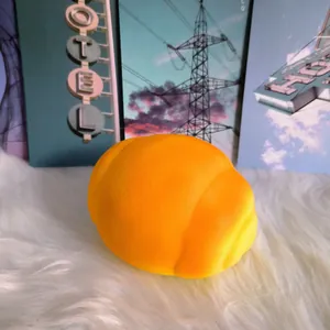 Detailed macro view of a large yellow slow-rising squishy bread toy with soft foam texture