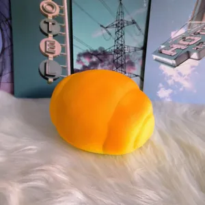 Slow rising squishy pig bun bread toy with soft foam texture on white fur background.