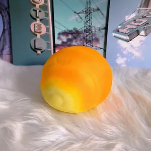 Close-up detail of a large orange gradient pig bun slow-rebound squishy toy
