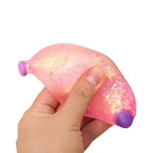 Pink glitter banana squeeze toy for stress relief and sensory play, squishy slow rebound.