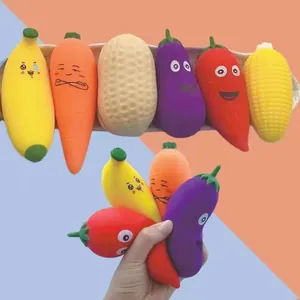 Detailed view of hand squeezing various TPR vegetable and fruit squishy toys for stress relief