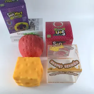 Gedetailleerd overzicht van zachte TPR fruit- en kaas-knijpspeeltjes met originele dozen
