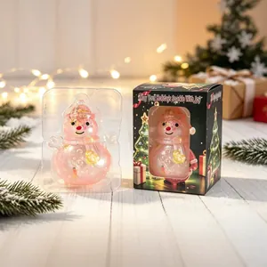 Rosa glitzerndes Schneemann-Squishy-Spielzeug in festlicher Weihnachtsgeschenkbox