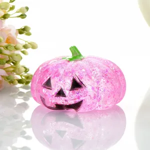 Pink glittery glow-in-the-dark Halloween pumpkin miniature figurine for DIY craft decor