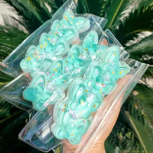 Ημιδιαφανές παιχνίδι πεταλούδας squishy σε πράσινο μέντας με πολύχρωμο γκλίτερ και πέρλες
