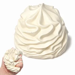 Detailed view of white whipped cream squishy toy showing soft slow rebound texture