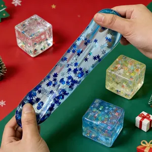 Detail view of a blue Christmas-themed maltose squishy toy being stretched for stress relief