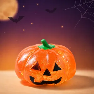 Orange pumpkin Halloween squishy stress ball toy with glitter for stress relief