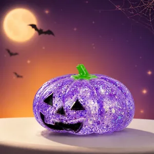 Purple glitter pumpkin squeeze toy with Jack-o'-lantern face for Halloween stress relief