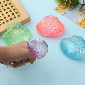 Detailed view of colorful glitter seashell squishy stress relief toys for sensory play