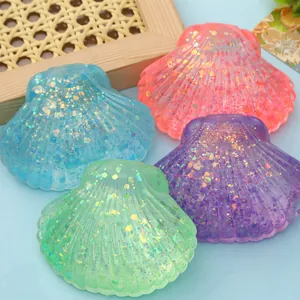 Detailed macro view of colorful glitter-filled shell squeeze toys for ocean-themed stress relief