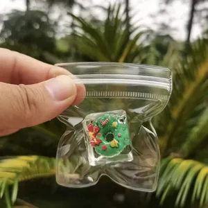 Close-up of a festive Christmas donut squishy toy encased in a clear ice cube gift