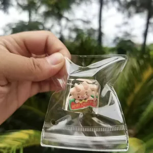 Detailed close-up showing a Christmas squeeze toy inside its clear plastic gift bag