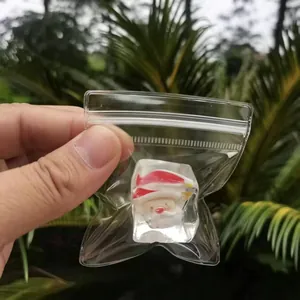 Handheld Christmas Santa Claus ice cube squeeze toy in a star-shaped bag