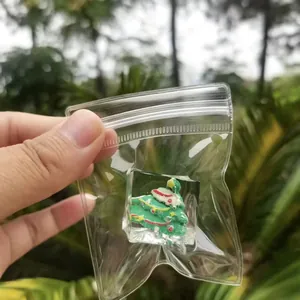 Miniature Christmas tree ice cube squeeze toy packaged in a clear zip-lock bag for stress relief