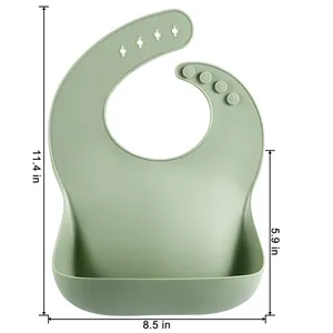 Waterproof green silicone baby bib with food catcher pocket and detailed dimensions