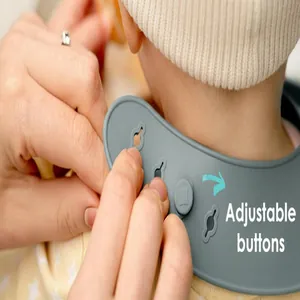 Detailed view of the adjustable button design on a soft waterproof silicone baby bib