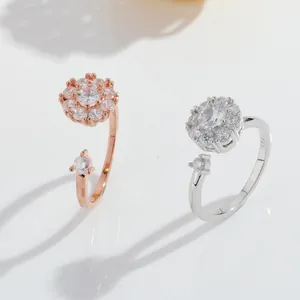 Elegant rotating flower open rings in rose gold and silver with cubic zirconia stones