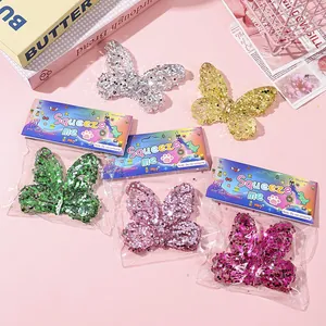 Macro view of colorful butterfly stress relief toys filled with large shiny sequins