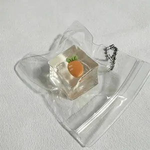 Cute carrot inside ice cube squeeze toy for stress relief in a transparent bag
