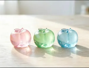 Close-up of translucent apple-shaped stress relief squishy toys in various colors.