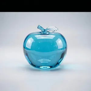 Detailed view of a blue translucent apple-shaped squishy stress relief fidget toy