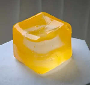 Detailed close-up of a translucent yellow maltose ice cube sensory stress relief toy