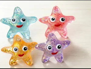 Macro detail of colorful glittery starfish-shaped stress relief squishy toys for adults