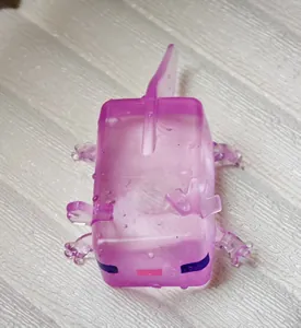 Close-up of a purple translucent axolotl stress relief toy with ice cube texture.