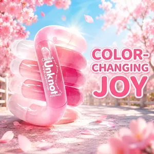 Detail view of pink Unknot color-changing fidget toy with twisty design in cherry blossoms