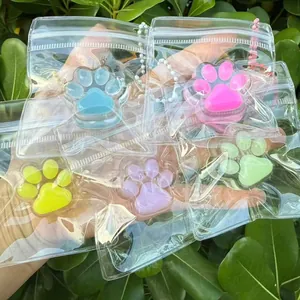 Set of colorful mini cat paw squishy toys in individual transparent zip packaging