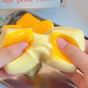 Detailed macro view showing the soft and stretchy texture of a mango squishy toy