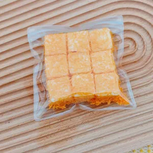 Detailed view of 9 coconut milk cube squishy toys in a clear bag for stress relief.